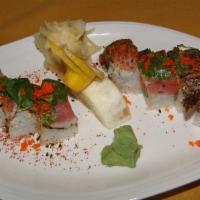 Duke Roll · Spicy tuna and avocado on the inside topped with black pepper tuna, cilantro and schichimi J...
