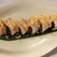 Yimi Roll · Spicy tuna, avocado, cucumber on the inside wrapped with yellowtail and topped with chef's s...