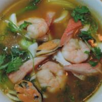 Japanese Seafood Noodle Soup · Fresh shrimp, squid, crab meat with baby bok choy, green onion, and cilantro in a mild spicy...