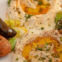 Veggie Mezza · With pita. Hummus, baba ghanoush, tabbouleh, falafel, grape leaves. (V) Served with one Pita