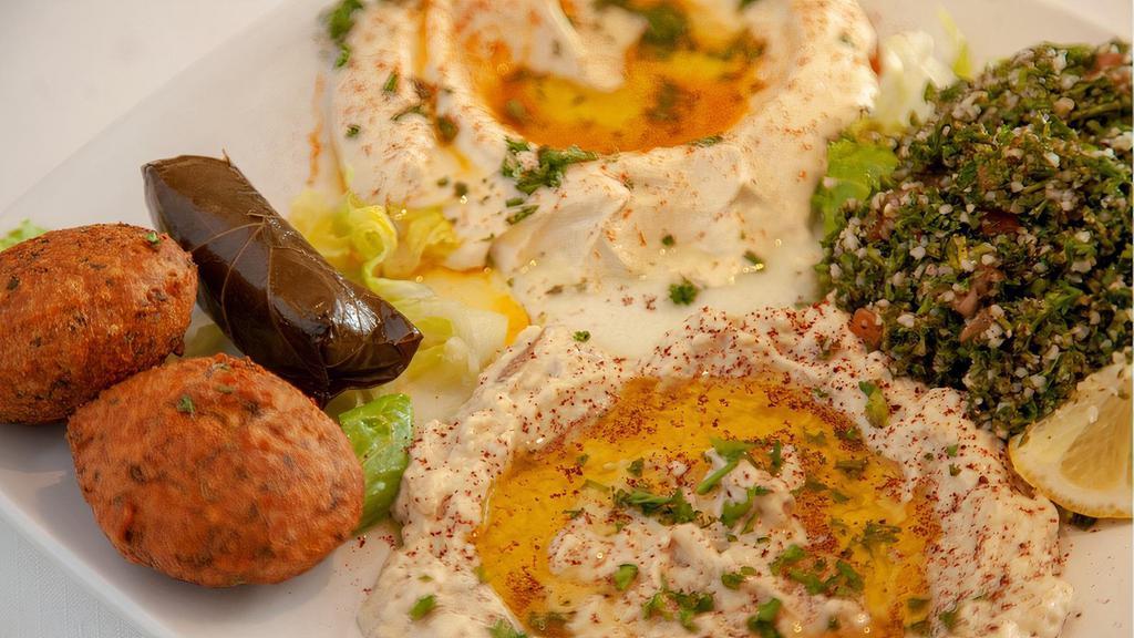 Veggie Mezza · With pita. Hummus, baba ghanoush, tabbouleh, falafel, grape leaves. (V) Served with one Pita
