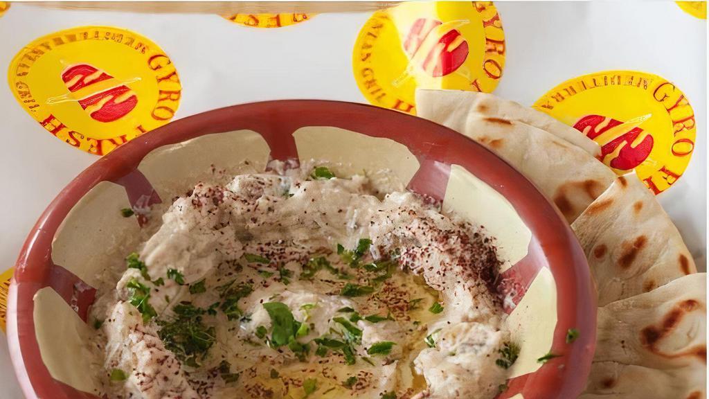 Baba Ghanoush  · Fire Roasted eggplant, pureed and blended with Tahini and lemon juice and spices. (V) (GF) Served with one  Pita
