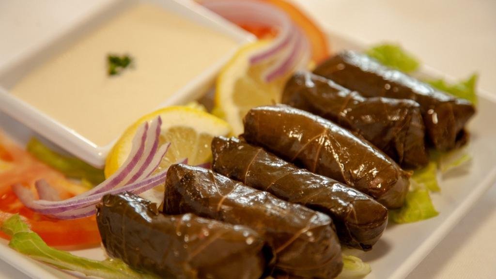Grape Leaves · Gluten free. Grape leaves stuffed with rice and veggies. (V).