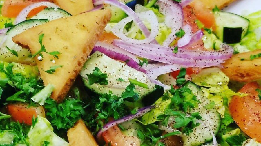 Fattoush Salad · Romaine lettuce, tomatoes, cucumbers, onions, sumac, fried pita bread and house dressing.
