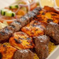 Mix Kabab Grill   · Lamb kabab skewer , chicken kebab skewer and kofta kabab char broiled on open fire . Made to...