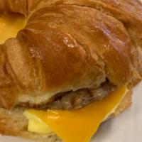 Croissant Sandwich · Includes egg, cheddar and meat : sausage, bacon or ham.