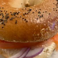 Lox Bagel · Includes lox, cream cheese, tomatoes and red onions.
