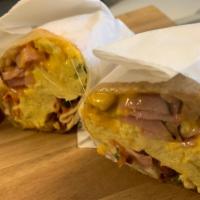Farmers (Bacon, Ham, Sausage & Potatoes) · Comes with sausage, bacon, ham and hash browns.
All burritos include scrambled eggs, onions,...