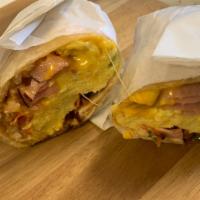 Breakfast Burrito · Meat choice: sausage, bacon or ham.
All burritos include scrambled eggs, onions, peppers, to...