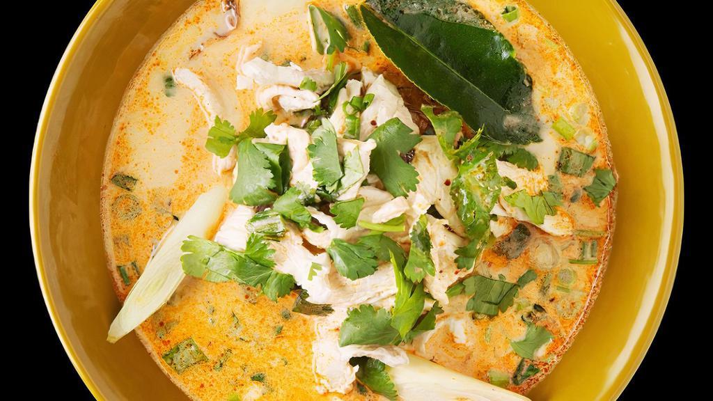 Family Size Tom Kha Gai** · Chicken broth with coconut milk, lemongrass, lime juice, scallions, and cilantro.