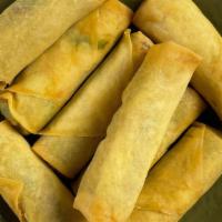 Family Size Spring Rolls** · 8  crispy rolls filled with Cabbage, Green Beans, Carrots, Mushrooms, Onions, Vermicelli, Sp...