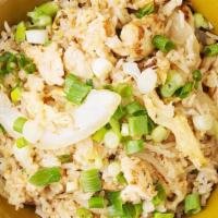 Thai Fried Rice ** · Rice, egg, yellow onions with special cooking sauce topped with scallions.