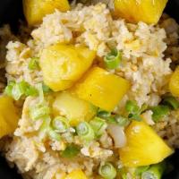 Pineapple Fried Rice ** · Rice, pineapple, egg, yellow onions and your choice of protein stir fried with our special c...