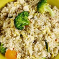 Vegetable Fried Rice ** · Rice, egg, carrots, broccoli, zucchini, yellow onions with special cooking sauce topped with...