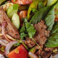 Beef Salad · Grilled beef, basil, tomato, cucumber, green onion, red onion, cilantro, roasted rice