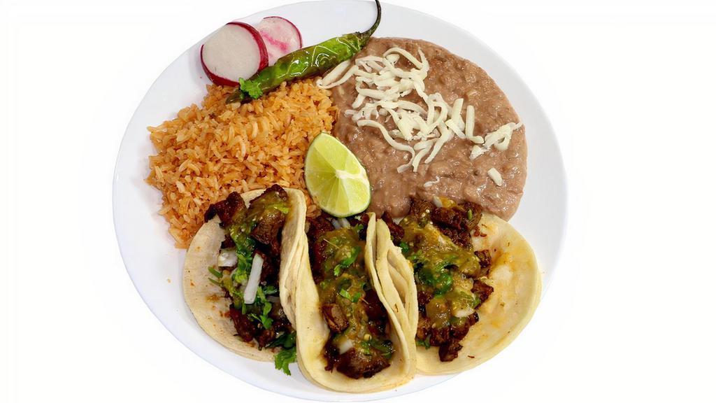 #3 - 3 Tacos Plate · Always a fave! The famous street tacos! Corn tortilla tacos with your choice of protein. Topped with onions, cilantro, and house made tasty mild tomatillo salsa! Garnished with a lime, radishes, and a serrano pepper. Served with our one of a kind rice and beans.