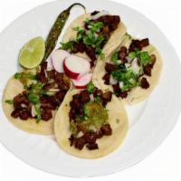 #4 - 4 Tacos · Always a fave! The famous street tacos! Corn tortilla tacos with your choice of protein. Top...