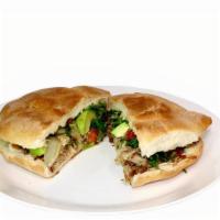 #22 - Torta · Bolillo bread with mayonnaise grilled and crispy. Smothered with beans, and filled with your...