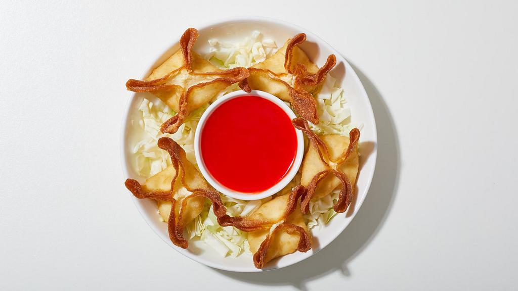 Wontons · Crispy fried wontons filled with cream cheese and served with house dipping sauce.