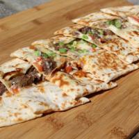 Super Mix Pide · Ground beef, potato, spinach. Pita dough that is then moulded to resemble an elongated pizza...