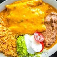 Enchilada Suiza · With your choice of cheese or ground beef, shredded beef or chicken served with lettuce, tom...
