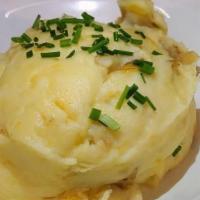 Yukon Mashed Potatoes · Yukon Gold potatoes mashed with sweet butter cream, sour cream, kosher salt, and white pepper.