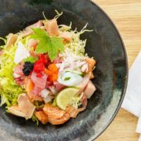 Spicy Chirashi · spicy poke bowl (tuna, salmon, hamachi, ika, letters, spring mix, seaweed and masago) with s...