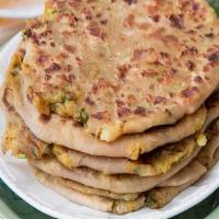 Aloo Paratha Lunch · Vegan. Unleavened layered whole wheat bread stuffed with potatoes, onions and fresh spices.