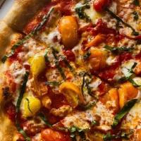 Margherita Pizza* · pomodoro, mozzarella, basil, heirloom tomatoes, basil oil