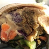 Turkey Burger Melt · White or whole wheat pita with organic mixed greens, tomatoes, cucumbers, carrots, red cabba...