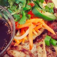 Banh Mi Bowl · Pour in the special house sauce and mix. Included in the bowl are lettuce, cucumber, steamed...