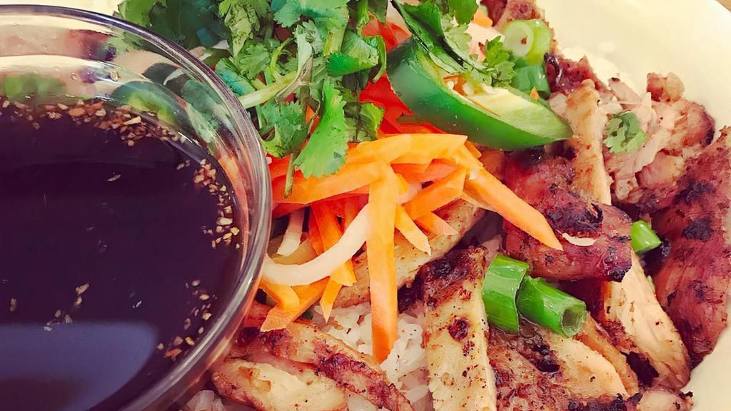 Banh Mi Bowl · Pour in the special house sauce and mix. Included in the bowl are lettuce, cucumber, steamed rice, bean sprouts, pickled carrots and daikon, jalapenos, green onion oil, toasted sesame seeds, cilantro, and your choice of charbroiled meat.