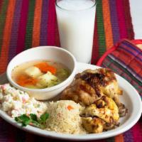 Pollo Asado A La Parrilla · Grilled chicken served with rice and Rusa salad (house salad). Pollo asado a la parrilla ser...