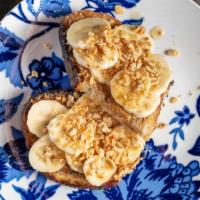 Banana Toast · AZ Local Proof bread with almond butter, banana, granola and drizzled with wild flower honey.