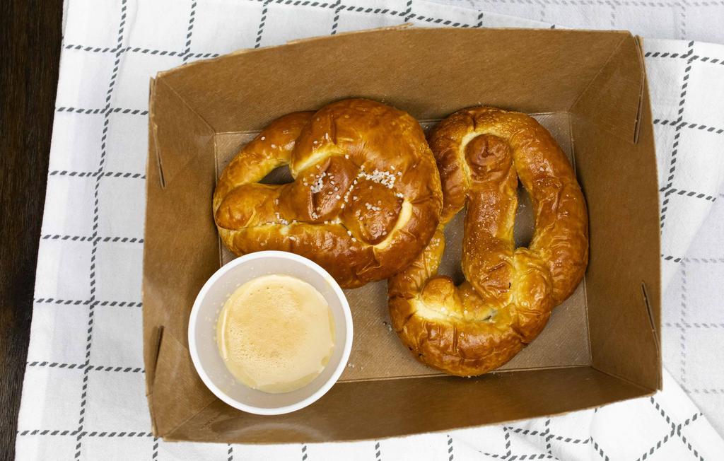 Bavarian Pretzels · Two house-made pretzels accompanied by stout beer cheese sauce and whole-grain mustard.