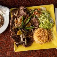 Carne Asada Plate · Grilled Arrachera steak served with rice, beans,
guacamole, pico de gallo , grilled onions, ...