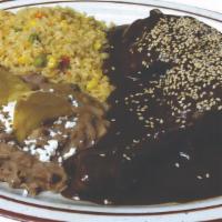 Pollo Con Mole · Diced chicken breast smothered in a rch red mole sauce that is slightly sweet and spicy, top...