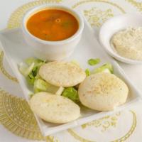 Idli Sambar · Steamed cake from a batter of black lentil and rice. Served with chutney and sambar.