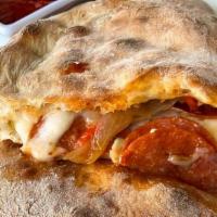 Calzone · Scarmoza, ricotta, mozzarella, tomato, basil, and additional filling of your choice