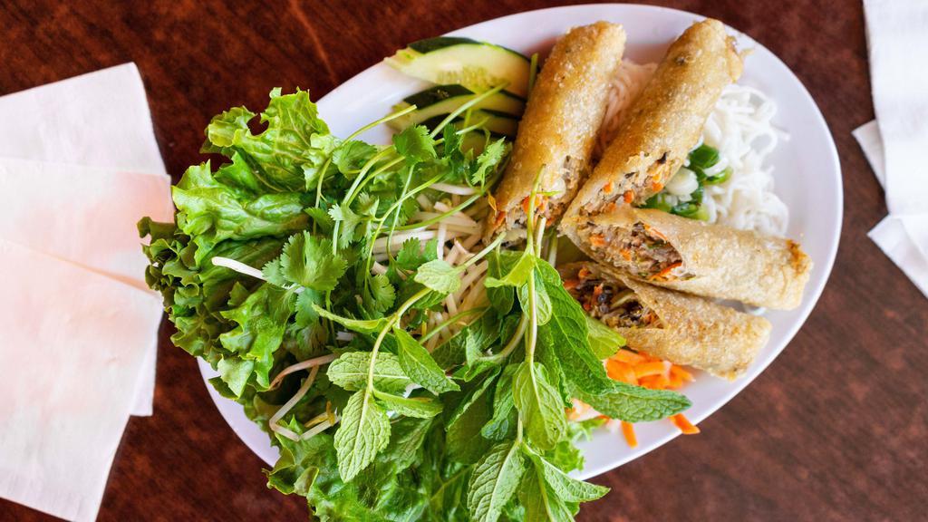Vietnamese Egg Rolls (2) / Cha Gio (2 Rolls) · Pork meat wrapped with rice paper and deep fried. Served with fresh vegetables, vermicelli rice noodle and homemade dipping lime sauce.