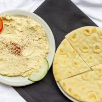 Hummus & Pita · A blend of garbonzo beans, tahini, garlic and lemon juice served /w pita.