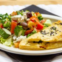 Spanakopita/W Greek Salad · Spinach and feta cheese wrapped in phyllo.