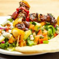 Chicken, Lamb Or Gyro Greek Salad · Grilled Chicken or lamb skewers on Greek salad topped /w feta cheese, olives and pita wedge.