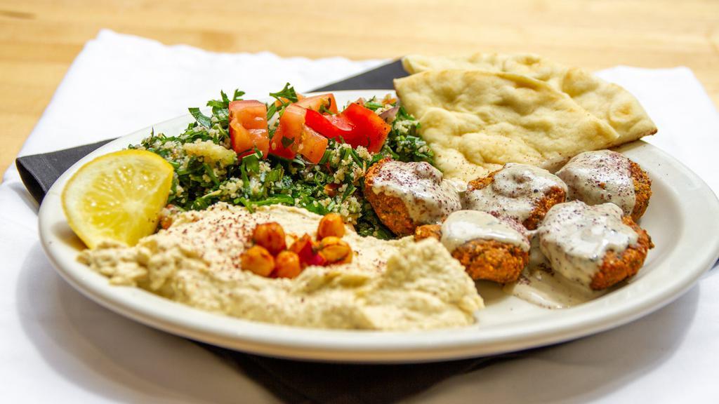 Falafel Plate (Vegetarian) · Falafel served w/ hummus, tabouli, greek salad and pita.
