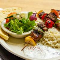 Lamb Kebobs · Two herb grilled lamb skewers served w/ fresh salad, rice, pita and yogurt sauce.