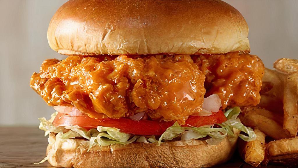 Buffalo Crispy Chicken · Fried chicken with buffalo seasoning, pepper jack, lettuce, tomato, pickles, and spicy ranch served on a brioche bun.