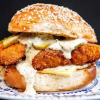 Fish Sandwich · Beer battered Alaskan cod with lettuce, tomato, and pickles served on a brioche bun with fra...