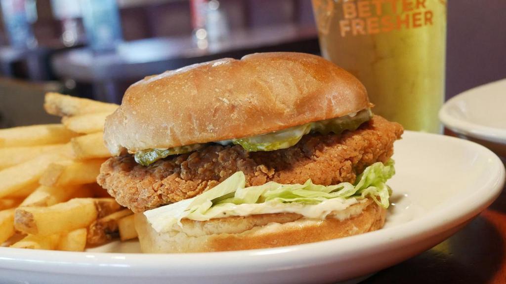 Roost Chicken Sandwich · Breaded chicken breast with lettuce, pickles, black pepper mayo on a kaiser bun