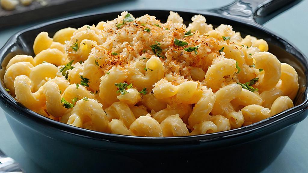 Ram Mac & Cheese · Cavatappi elbow pasta, rich, creamy cheddar cheese sauce, gratiné