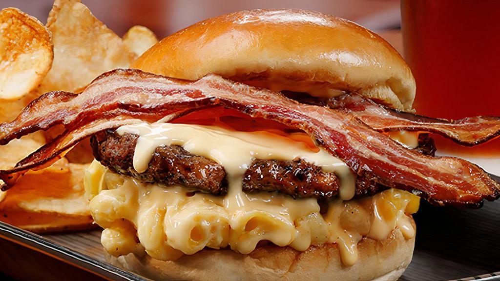 Bacon Mac & Cheese Burger · Grilled *beef patty | creamy mac & cheese | cheddar cheese sauce | applewood-smoked bacon | kaiser bun